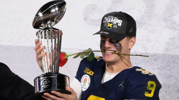 Michigan Wolverines quarterback J.J. McCarthy (9) hold the Rose Bowl trophy after the wolverines defeated the Alabama Crimson Tide in the 2024 Rose Bowl college football playoff semifinal game at Rose Bowl. 